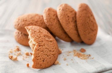 Tasty oatmeal cookies on table