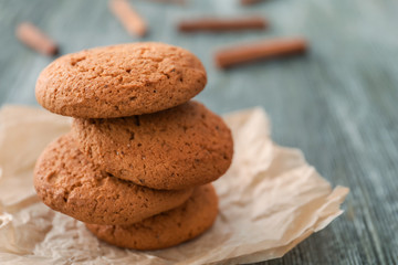 Tasty oatmeal cookies on table