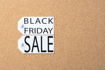 Black Friday sale tags are pinned to the cork board
