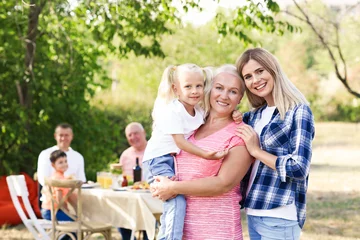 Foto op Canvas Happy family having barbecue party outdoors © Africa Studio