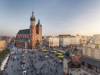 Old city center view in Krakow, aerial drone photography at sunset time, famous cathedral in evening light