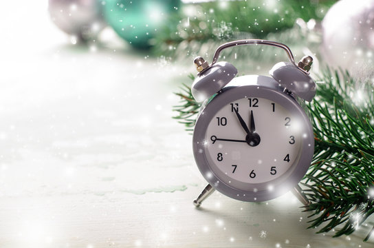 Grey Christmas Alarm Clock Showing Midnight, New Years Eve With Decorations On White Background