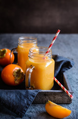 Persimmon smoothie in glass jars