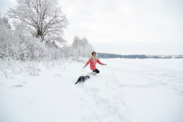 Family on holiday in the winter forest.