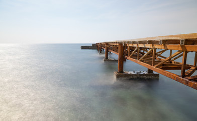 Fototapeta na wymiar long exposure pier at day