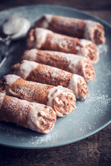 Sweet homemade cannoli with chocolate and vanilla cream,selective focus