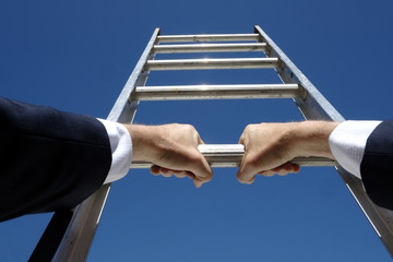 Climbing the corporate ladder business concept © davidmariuz