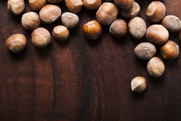 hazelnuts on wooden background
