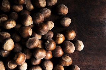 hazelnuts on wooden background