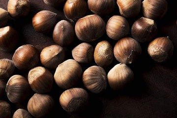 hazelnuts on wooden background