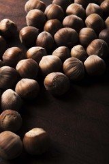 hazelnuts on wooden background
