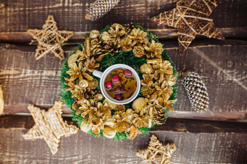 Christmas background with decorations and candles, candle on fire with woman hand