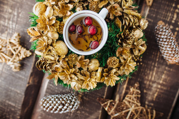 Christmas background with decorations and candles, candle on fire with woman hand