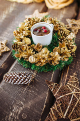 Christmas background with decorations and candles, candle on fire with woman hand