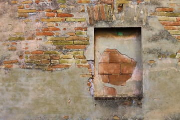 Walled window of an old ruined building (Pesaro, Italy)
