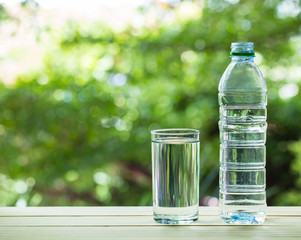 a glass of water on nature background.