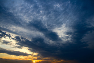 Naklejka na ściany i meble Dramatic sunset with clouds.