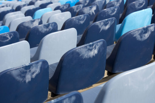 Blue Empty Seats In A Stadium From The Back