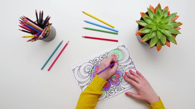 Timelapse Shot Of Woman'S Hands Coloring Design On Drawing Paper