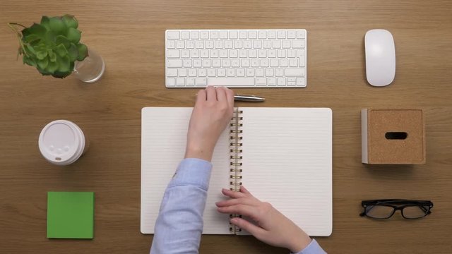 Overhead Top View Footage Of Woman Making To-Do List