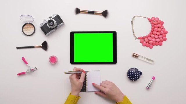 Overhead Top View Of Woman Writing By Digital Tablet And Cosmetics