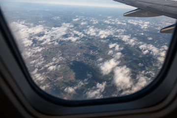 Fototapeta premium The view of the earth through the window of the plane.