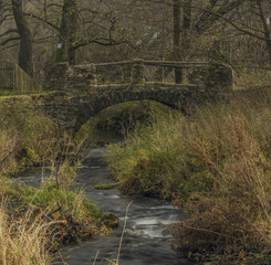 Stone bridge on Bobri creek in Ceske Stredohori mountains in Loucky village
