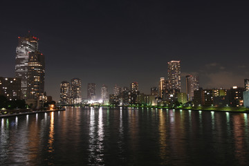 Fototapeta na wymiar 日本の東京都市景観「勝鬨橋から見る月島などの高層マンションなど」（手前は墨田川）