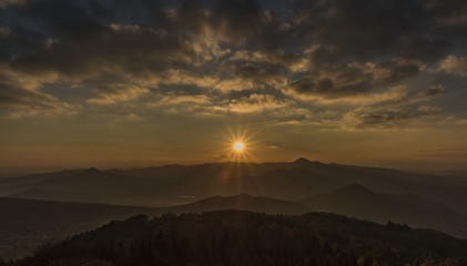 Sunset evening on Varhost hill in Ceske Stredohori mountains