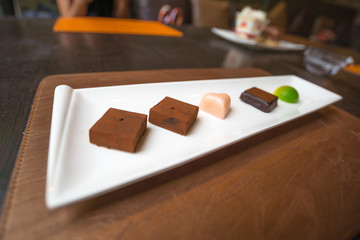 Five style of chocolate in white dish, girl like it