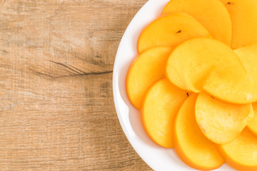 sliced persimmon on plate