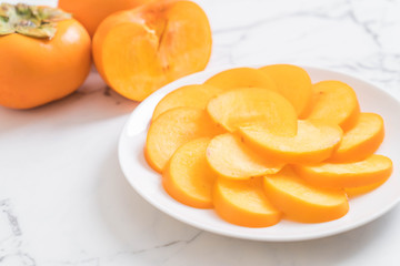 sliced persimmon on plate