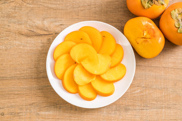 sliced persimmon on plate