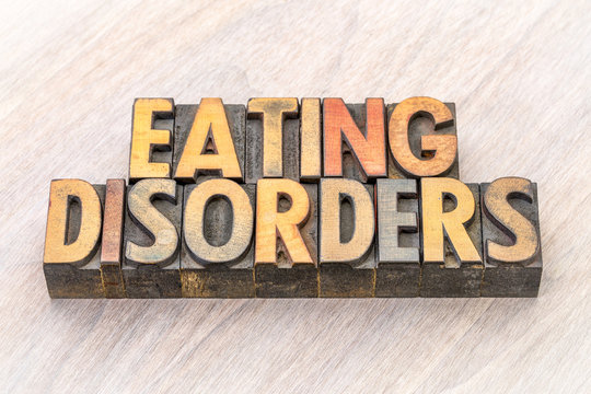 eating disorders word abstract in wood type