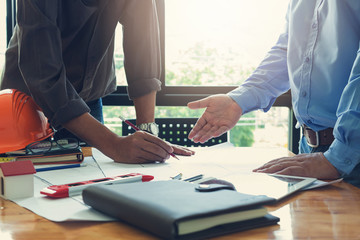 Engineer and Architect concept, Engineer Architects office team working and discussing house plan  model, Vintage Effect