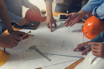 Engineer and Architect concept, Engineer Architects office team working and discussing house plan ...
