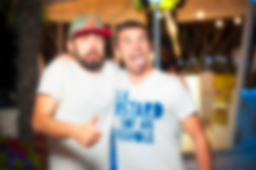 Blurred for background. People during concert in Ibiza night club party. Man and woman at club. Boy and girl at night club party. wedding party