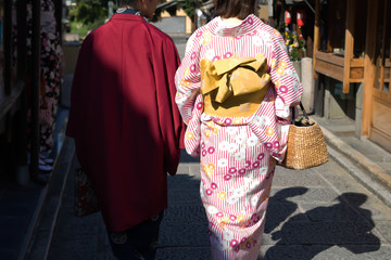 Japanese couple with Yukata and colorful traditional kimono in Kyoto, Japan