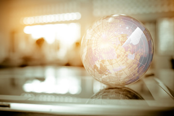 Earth globe model ball map with Radar background on tablet in classroom. Concept for global international educaiton or communications, politics environmental for learning world wide. vintage tone