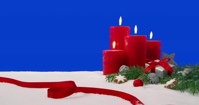 Fourth Sunday of Advent - Christmas decoration arrangement on a snowy table in front of a blue screen - ProRes