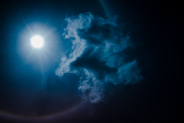 Obraz na płótnie Canvas Moon halo phenomenon. Nighttime sky and bright full moon with shiny.