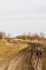 Dirty rural road in early spring 