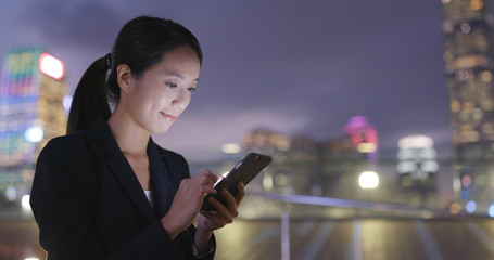 Business woman use of cellphone in Hong Kong
