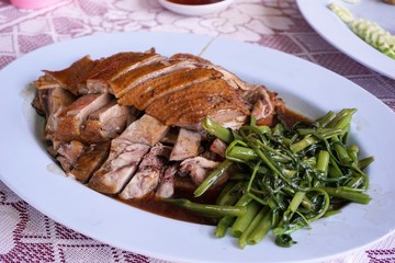close up Braised duck meat on plastic plate