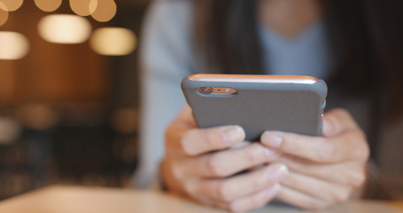 Using cellphone in coffee shop