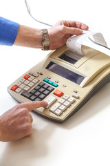 Hand presses cash register keys another takes out check