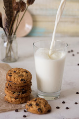 Milk in a glass and cookies with chocolate