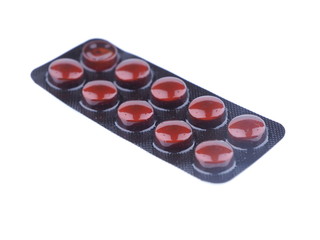 brown pills on a white background