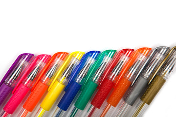 A set  colored pens on a white background