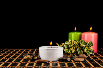 Aromatherapy. spa candles on a black background